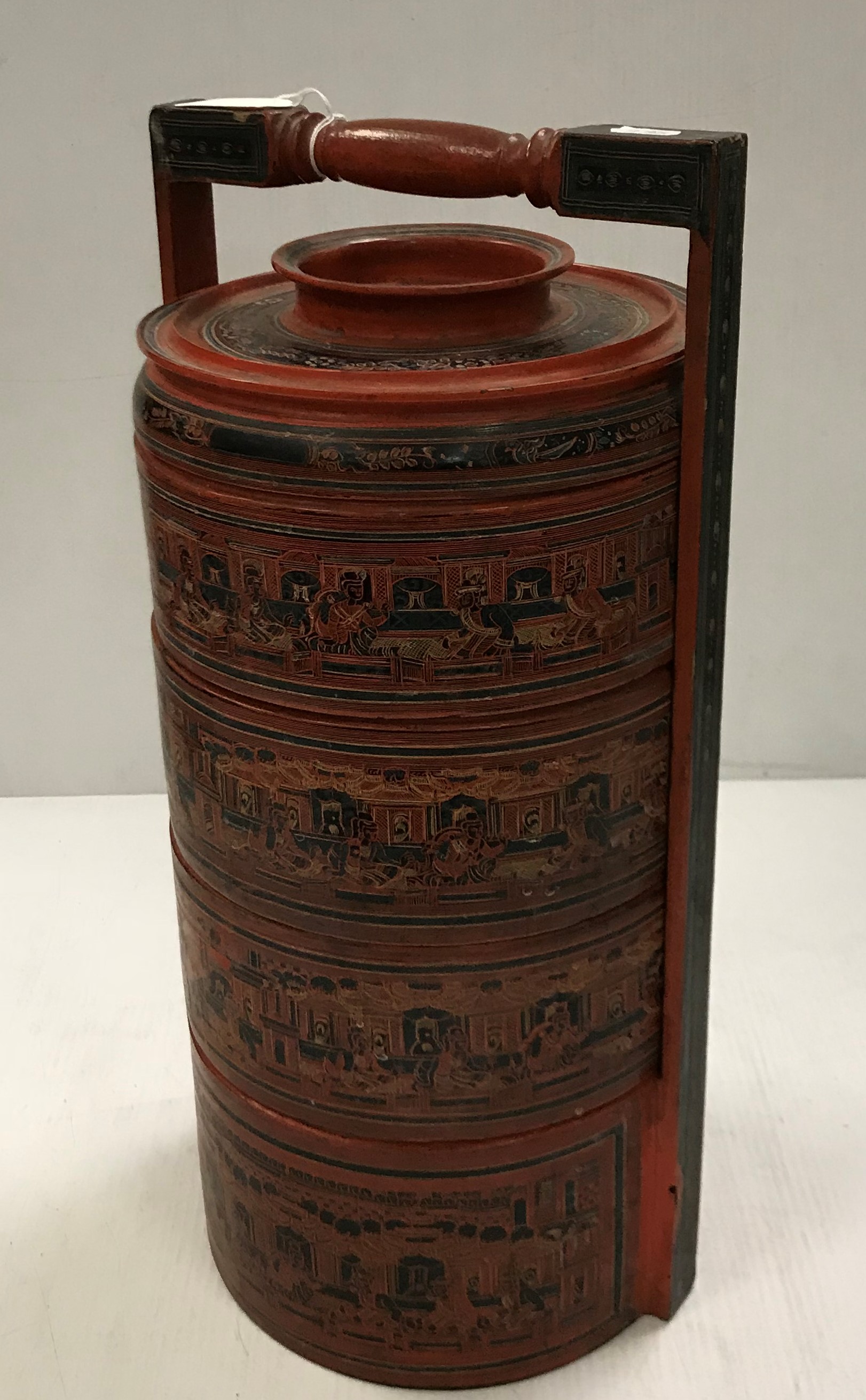 A small five section food container of cylindrical form 51 cm high
