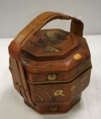 A South East Asian cane work and gilded wooden food container of octagonal form,