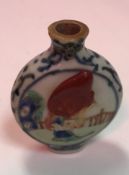 A blue and white and polychrome decorated snuff bottle bearing wax seal,