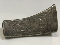 A late 19th/early 20th Century silver betel leaf holder of triangular stylised horn form decorated