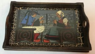 A Quimper wooden tray with porcelain centre decorated with a Breton couple in traditional costume