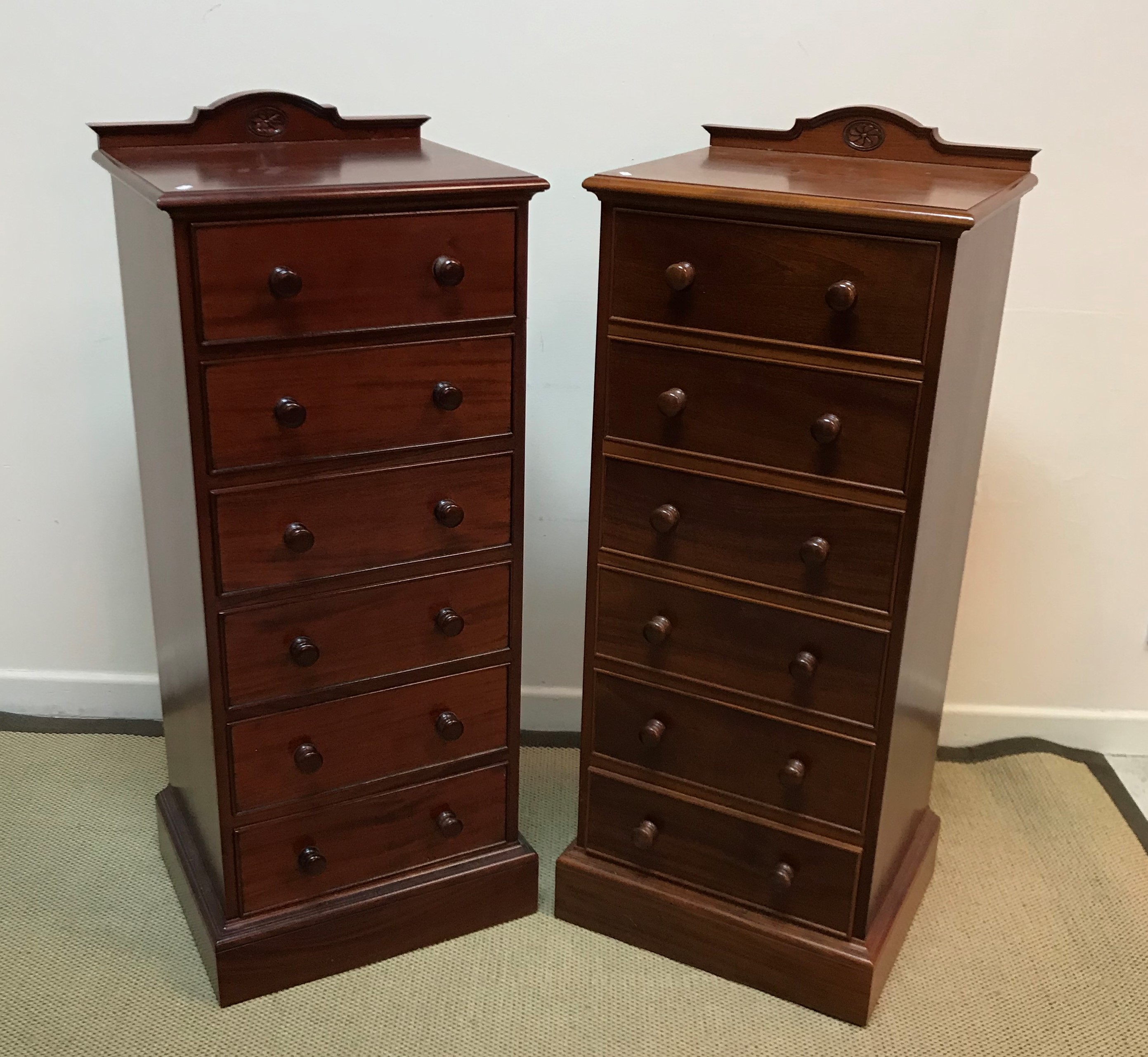 A pair of modern mahogany slim chests of six drawers in the Victorian taste 51 cm wide x 43.