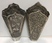 A 19th Century silver betel leaf holder with embossed floral and foliate decoration of tapered form