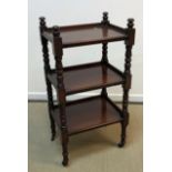 A mahogany three tier whatnot in the Victorian manner,