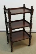 A mahogany three tier whatnot in the Victorian manner,