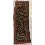 A Bokhara rug, the central panel set with repeating diamond medallions,