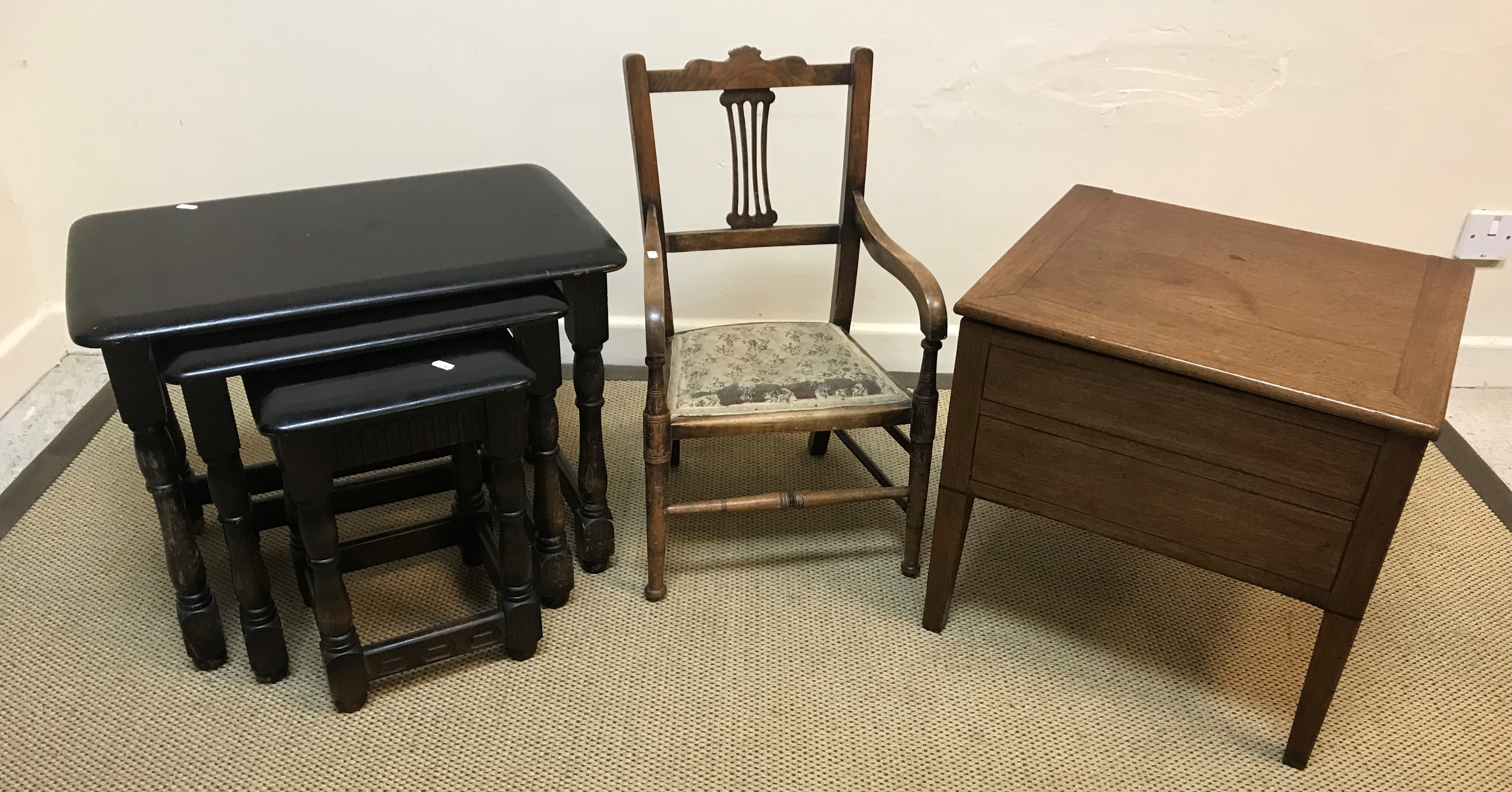 A modern stained oak nest of three occasional tables,