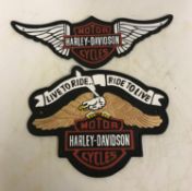 A modern painted cast iron sign inscribed "Harley Davidson Live to Ride Ride to Live",