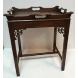 A mahogany tray top occasional table in the Georgian style on square moulded supports with fretwork