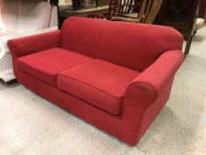 A modern red upholstered scroll arm two seat sofa, 176 cm wide x 85 cm deep x 78 cm high,