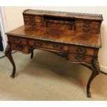 A late Victorian walnut writing table in the Louis XV taste,