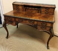 A late Victorian walnut writing table in the Louis XV taste,