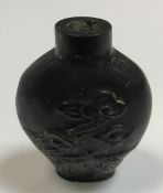 A Chinese carved hardstone scent bottle of flask form with foliate decoration, 6 cm x 4.