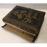 A Victorian musical photograph album inscribed "The Victorian Album" to the leather cover