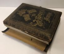 A Victorian musical photograph album inscribed "The Victorian Album" to the leather cover