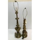 Two brass table lamps of column form both raised on circular stepped bases,