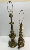 Two brass table lamps of column form both raised on circular stepped bases,