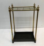 A brass and cast iron eight section stick stand of plain rectangular form 63 cm high x 23 cm deep x