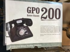 A collection of items comprising a ProtelX GPO 200 repro telephone,