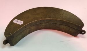 A 19th Century Philippines brass betel box of plain crescent form with two end lugs,
