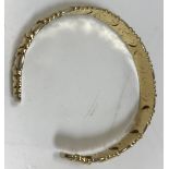 An Italian 18 carat bangle of segmented form, 6 cm diameter,