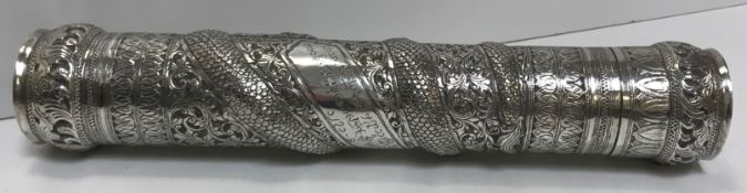 A Burmese silver document or manuscript holder with foliate and relief work serpent decoration and