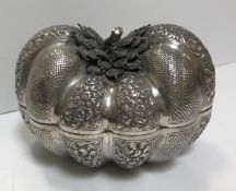 A Cambodian embossed silver lidded box of squash form, 19 cm x 14 cm x 12.