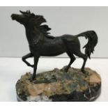 An Italian bronze horse study raised on a quartz decorated base to marble socle,