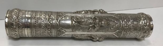 A Burmese silver document or manuscript holder, similarly decorated, 32.5 cm long x 6.