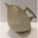 An Anthony Theakston sparrow beak jug in the form of a bird in stone coloured glaze,