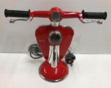 A modern reproduction table lamp in the form of a red scooter, "Lambretta", 26.