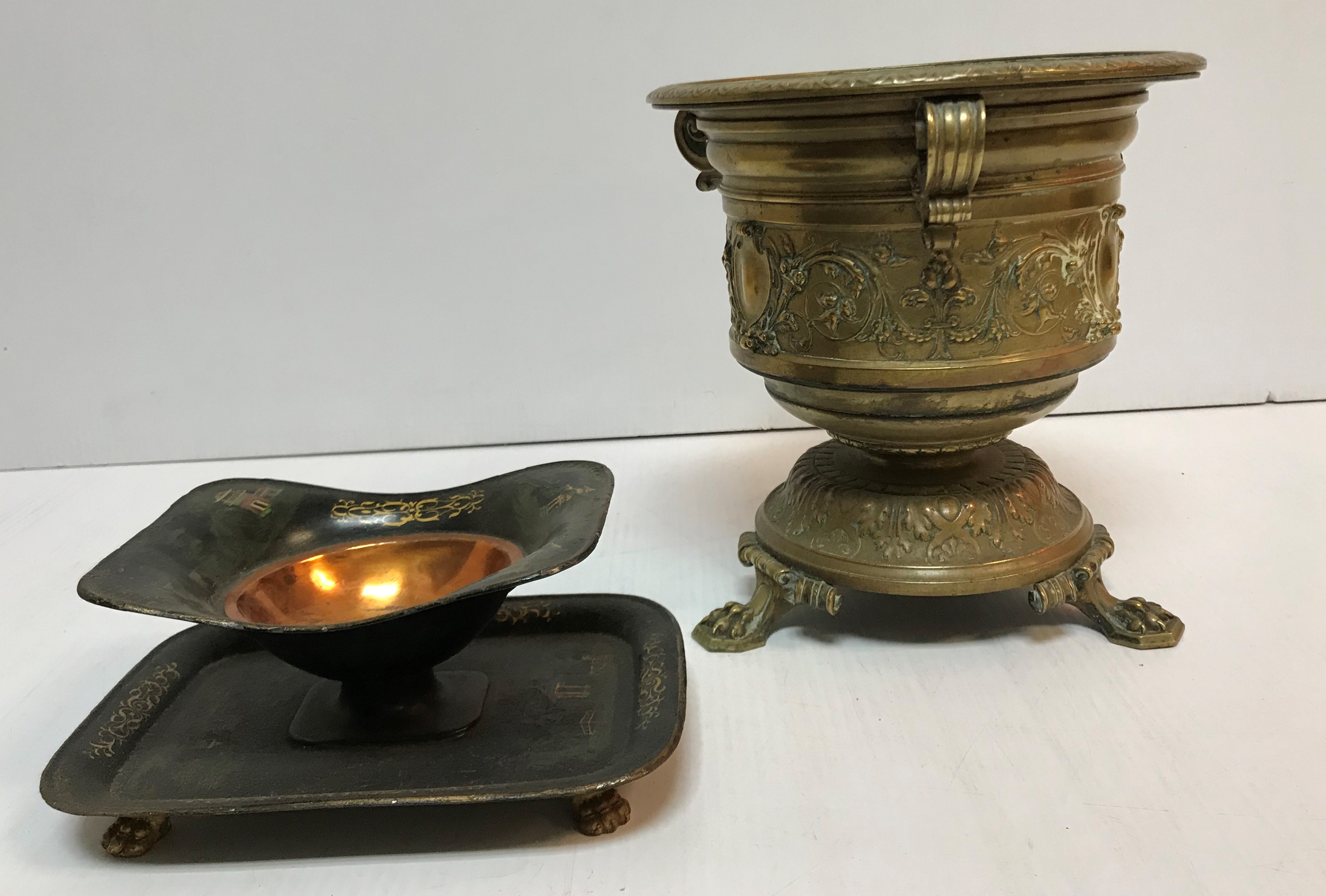 A toleware dish of rectangular form decorated with chinoiserie style buildings,