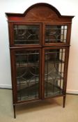 An Edwardian mahogany and inlaid display cabinet,