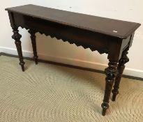 A Victorian oak side table of slim proportions,