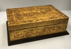 A Burmese giltwood and red lacquered rectangular box,