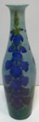 A Dennis Chinaworks vase decorated with blue foxgloves designed by Sally Tuffin No'd 7 and