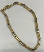 A 9 carat gold bicycle style chain link bracelet, 20.5 cm long, 13.