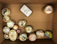 A collection of sixteen various Halcyon Days pill boxes and a Royal Worcester pill box,