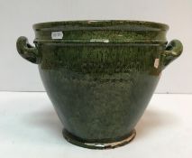 A late Victorian green glazed Ewenny Pottery two handled jardiniere/pot inscribed "Cymru Dros Byth"