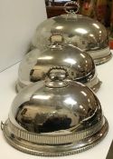 A graduated set of three electro-plated food domes by Roberts & Belk, largest 42 cm x 31.