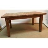 A modern oak extending rectangular dining table on square supports together with a set of six high