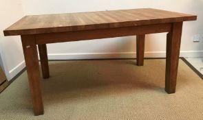 A modern oak extending rectangular dining table on square supports together with a set of six high