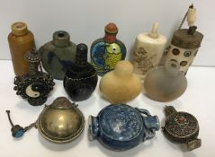 A collection of twelve various Oriental snuff/scent bottles in hardstone, lacquer, pottery,
