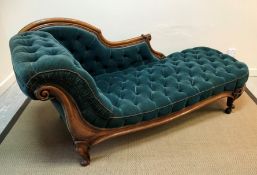 A Victorian walnut framed buttoned upholstered chaise longue on cabriole legs to scroll feet,