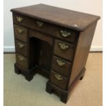 A George III mahogany kneehole desk of small proportions,