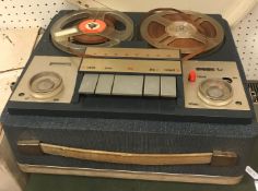 An Akai 3000D solid state reel to reel tape player together with an NEC authentic series A230E