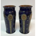 A pair of Royal Doulton blue ground relief work decorated vases, 31.
