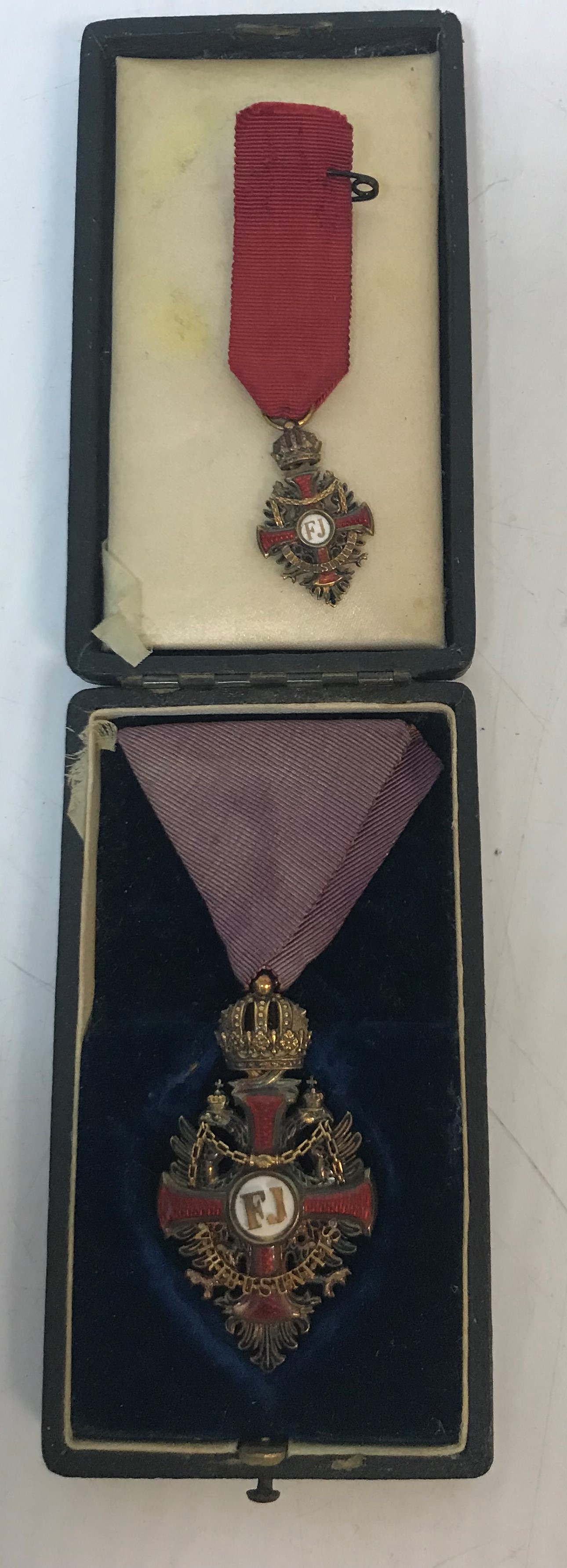 An Imperial Order of Franz Joseph, Knight's cross with triangular ribbon, the medal 5.