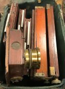 A mahogany and brass bound camera bellows section,