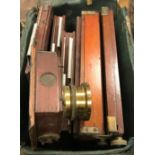 A mahogany and brass bound camera bellows section,